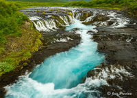 Blue Glacial Water and Waterfall