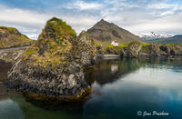 Sea Sculpted Rock Formations and House