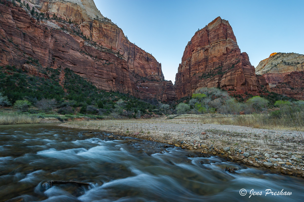 Angels Landing at sunset and Cottonwood trees along the Virgin River. The hike to the top of Angels Landing is very popular and...