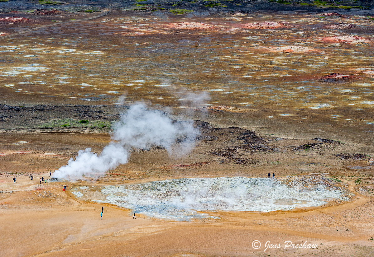 A lunar like landscape of mud cauldrons, steaming vents, radiant mineral deposits and piping fumaroles.