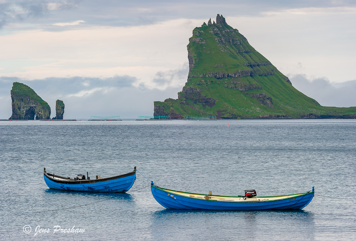 Tindholmur looks like a giant shark dorsal fin. It's 262 metres high and it was once inhabited. The free-standing rocks stacks...
