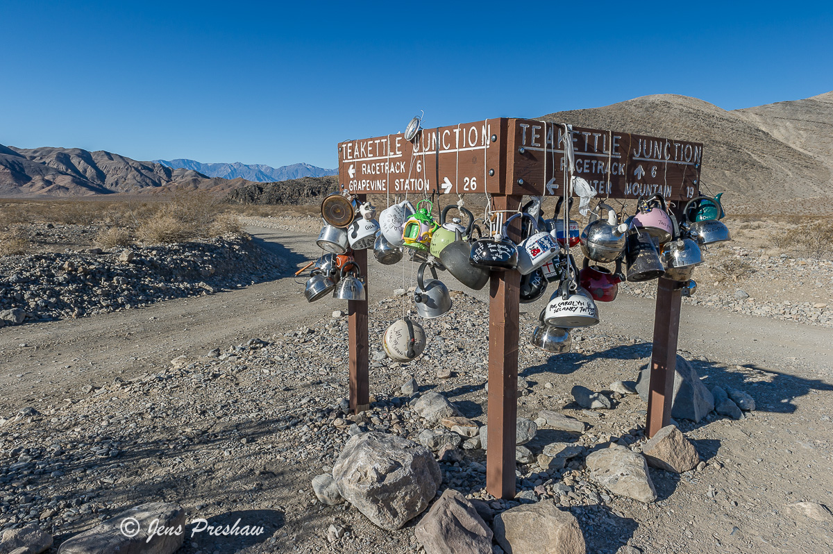 At Teakettle Junction in Death Valley National Park people from all over the world leave a teakettle hanging on this National...