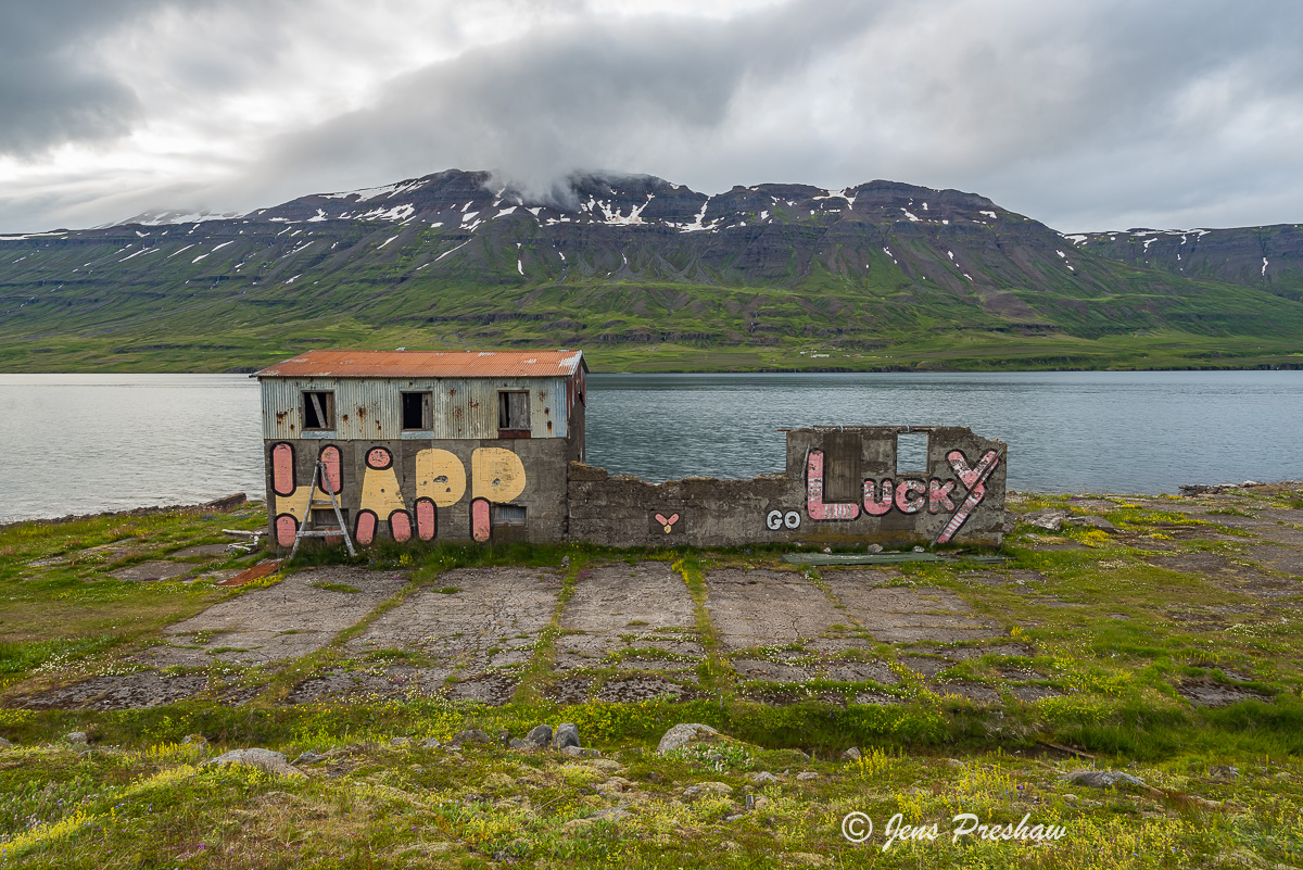 This abandoned farmhouse along the fjord had the graffiti&nbsp;Happy Go Lucky&nbsp;spray painted on it.