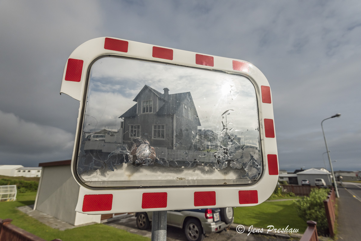 A traffic mirror in the coastal town of Grindavik where most of the residents are involved in the fishing industry.